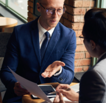 Consultant advising a client across a desk