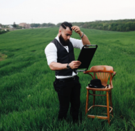 Farm manager reviewing records in a green field