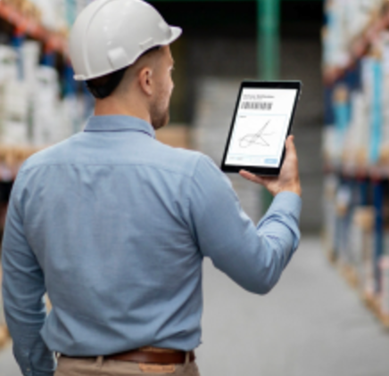 Warehouse worker checking stock on a tablet